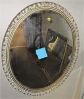 Mirror in oval frame