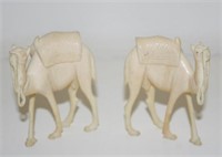 Two carved ivory figures of camels