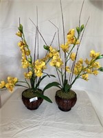 Two faux floral arrangements