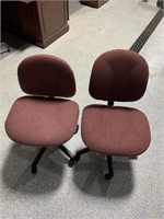 Two rolling office chairs