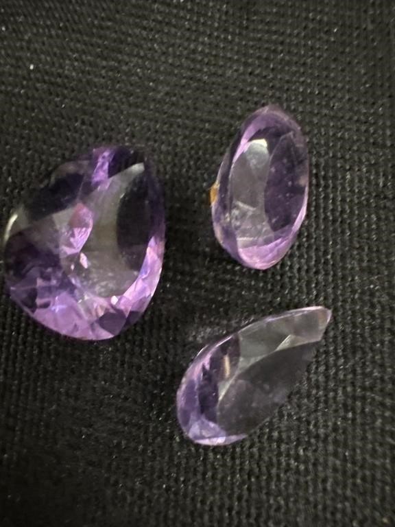 Two pear cut  and one oval cut, faceted amethyst