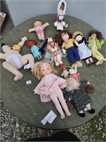 Table of vintage dolls