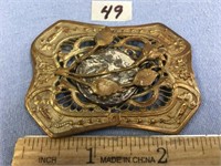 Beautiful buckle with a religious medal set into i