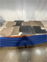 Assortment of used plastic car mats