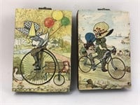 2 x hanging plaques of kids cycling