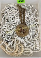 White beaded necklaces & medallion