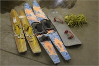 (2) SETS OF WATER SKIS, WITH ROPE, AND SNOWBOARD