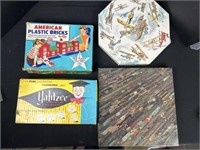Puzzles, Yahtzee game and American plastic bricks