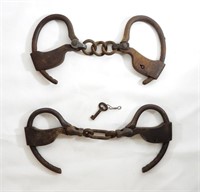 (2) ANTIQUE IRON HANDCUFFS w/KEY