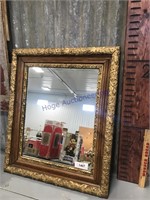 Gold-framed mirror, 23" x 27"