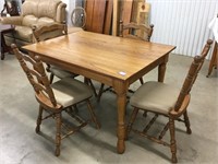 Nice oak table with 4 chairs.  50 x 33.5.