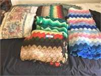 2 sofa pillows & a group of afghans