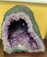 Large purple amethyst geode stone, cut and