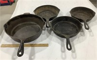 4 cast iron skillets - no visible brands