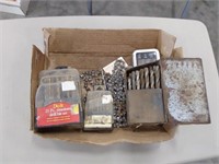 assortment of drill bits, chain saw chains