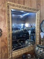 Ornate beveled gold tone mirror