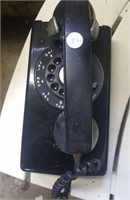 Black  vintage plastic wall phone with dial