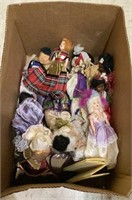 Box of vintage smaller dolls from all over the