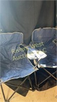 Two folding camp chairs