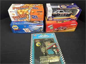 Four 1/24 scale, diecast metal race, cars with