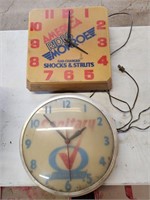 Three advertising clocks