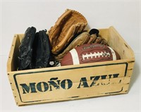 Wooden crate full of sporting items. Included