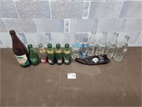 Antique pop bottles. Coke, 7up, Canada dry, etc