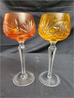 2 yellow and orange crystal glasses