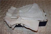 Box of linens including scarves, runners,