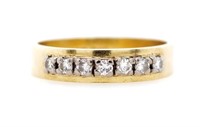 Seven stone diamond and 18ct yellow gold ring