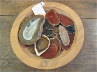 Wooden bowl full of polished rocks