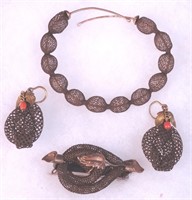 Four pieces of hair jewelry including earrings