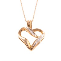 A Lady's Diamond Heart Pendant in 10K Gold