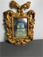 Ornate Carved and gold painted wall mirror