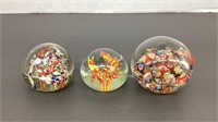 (3) paperweights. One has small chip on top as