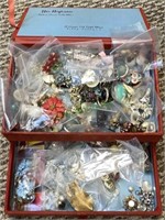 Jewelry box-like case filled with vintage clip on