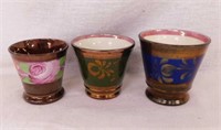 Three 1860's copper lustre English beakers,