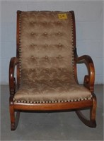 Gold uphostered rocking chair