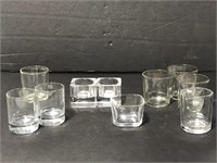 Assorted clear glass candle holders