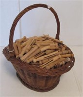 Basket with (100+) Old wood clothes pegs