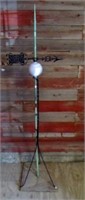 Lightning rod on base with opaque glass ball and