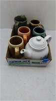 assorted mugs, teapot
