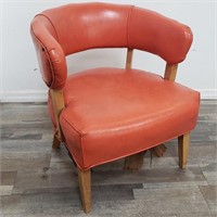 Mid century orange leather barrel back chair