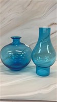 Blue glass vase and lantern globe.