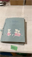 Scrapbook of vintage baby cards