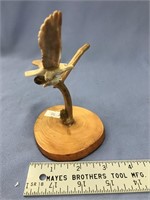 4" fossilized ivory carving of a bird with fish in