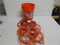Orange electric cords in bucket