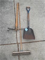 Short handled green shovel, pickax, and pushbroom