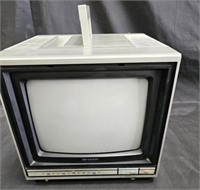 Group of vintage TVs, portable Panasonic radio,