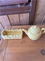 yellow planter and teapot